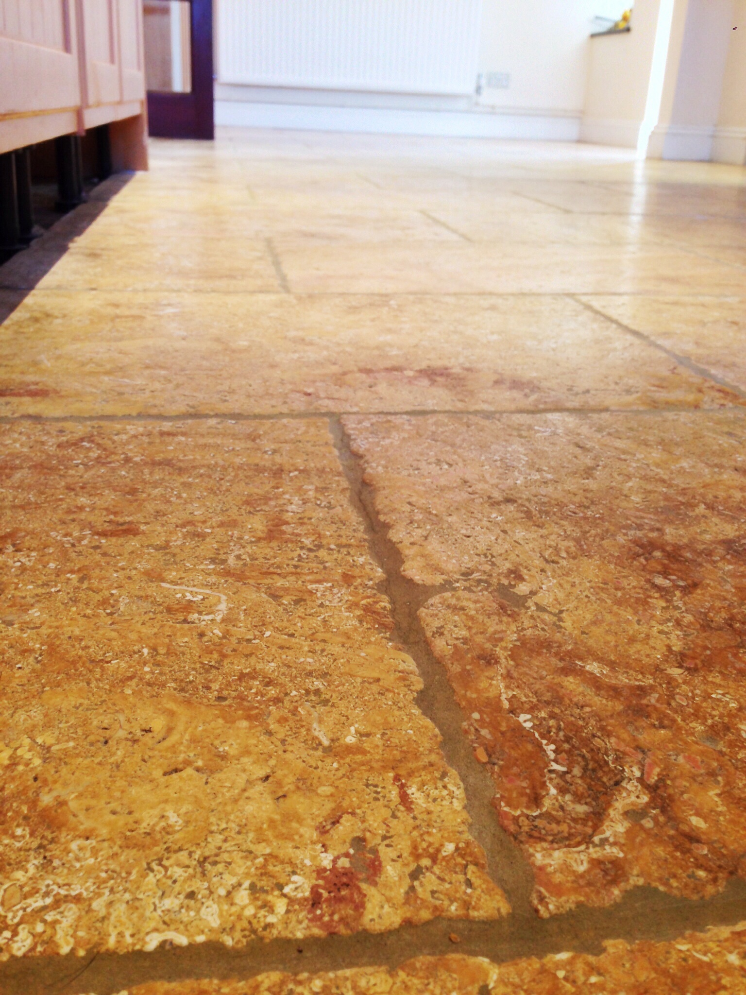 Limestone tiled kitchen floor AFTER restoration